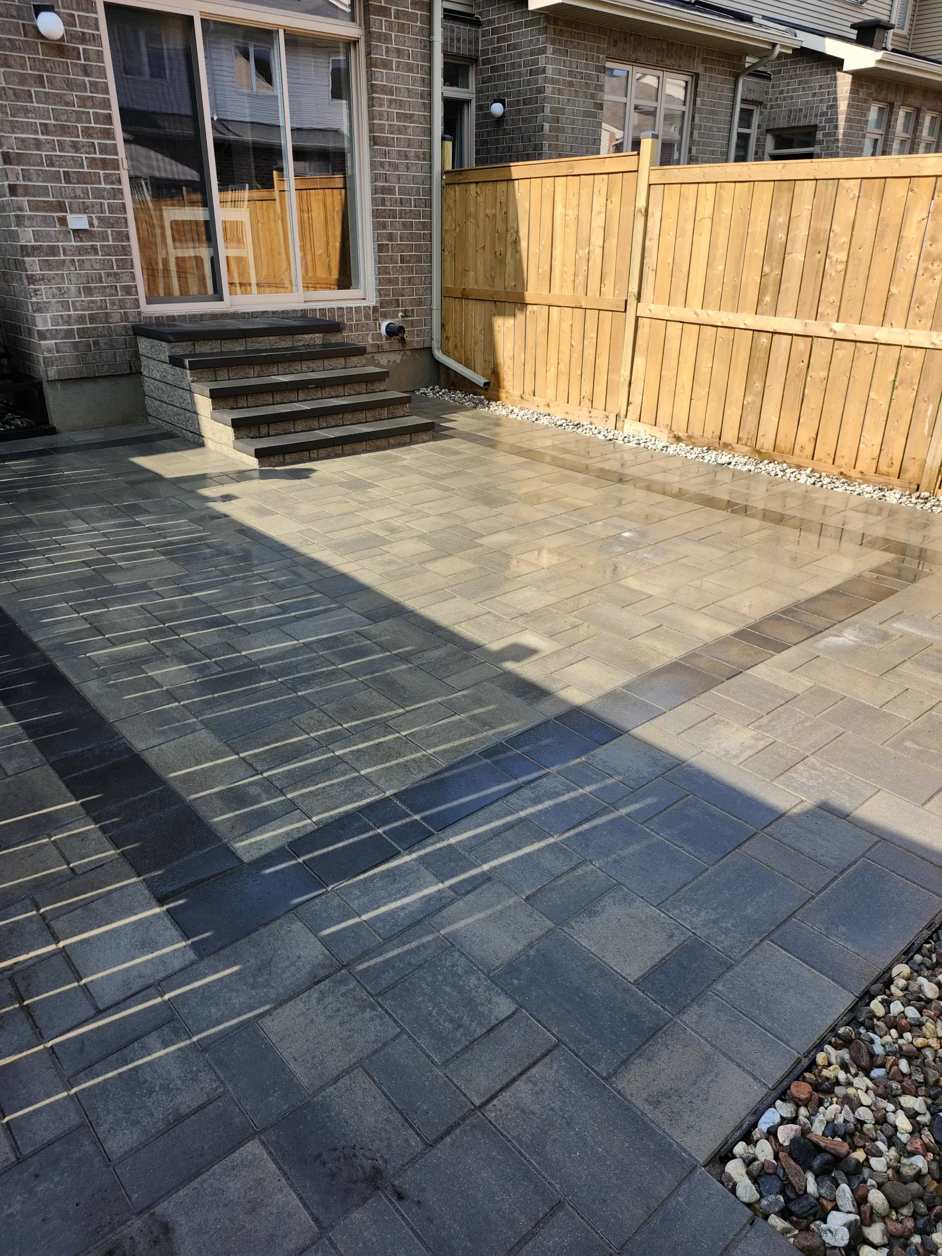 Multi-tone backyard patio with cedar-fence borders