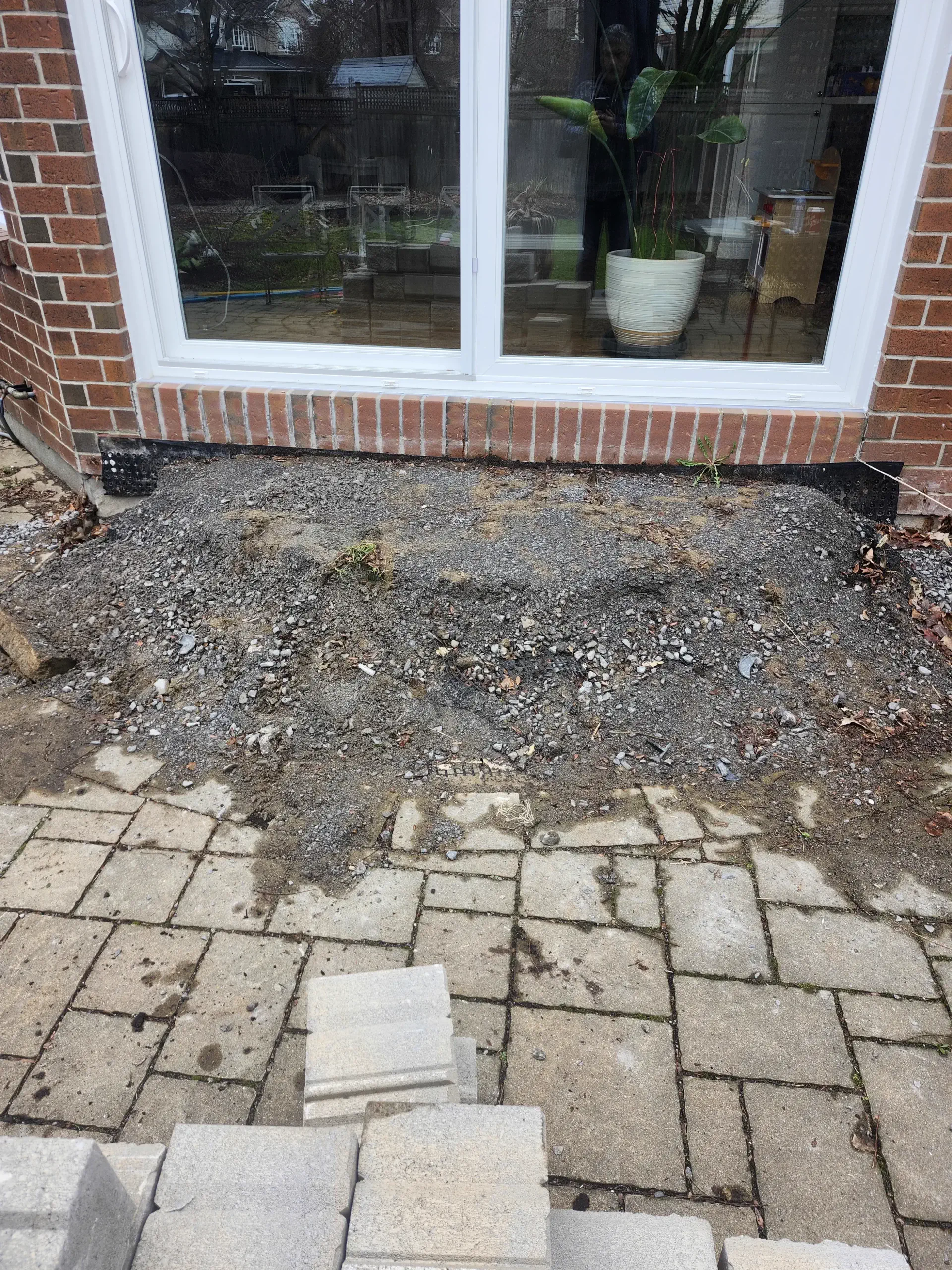 From uneven porch base to clean interlock built for proper drainage