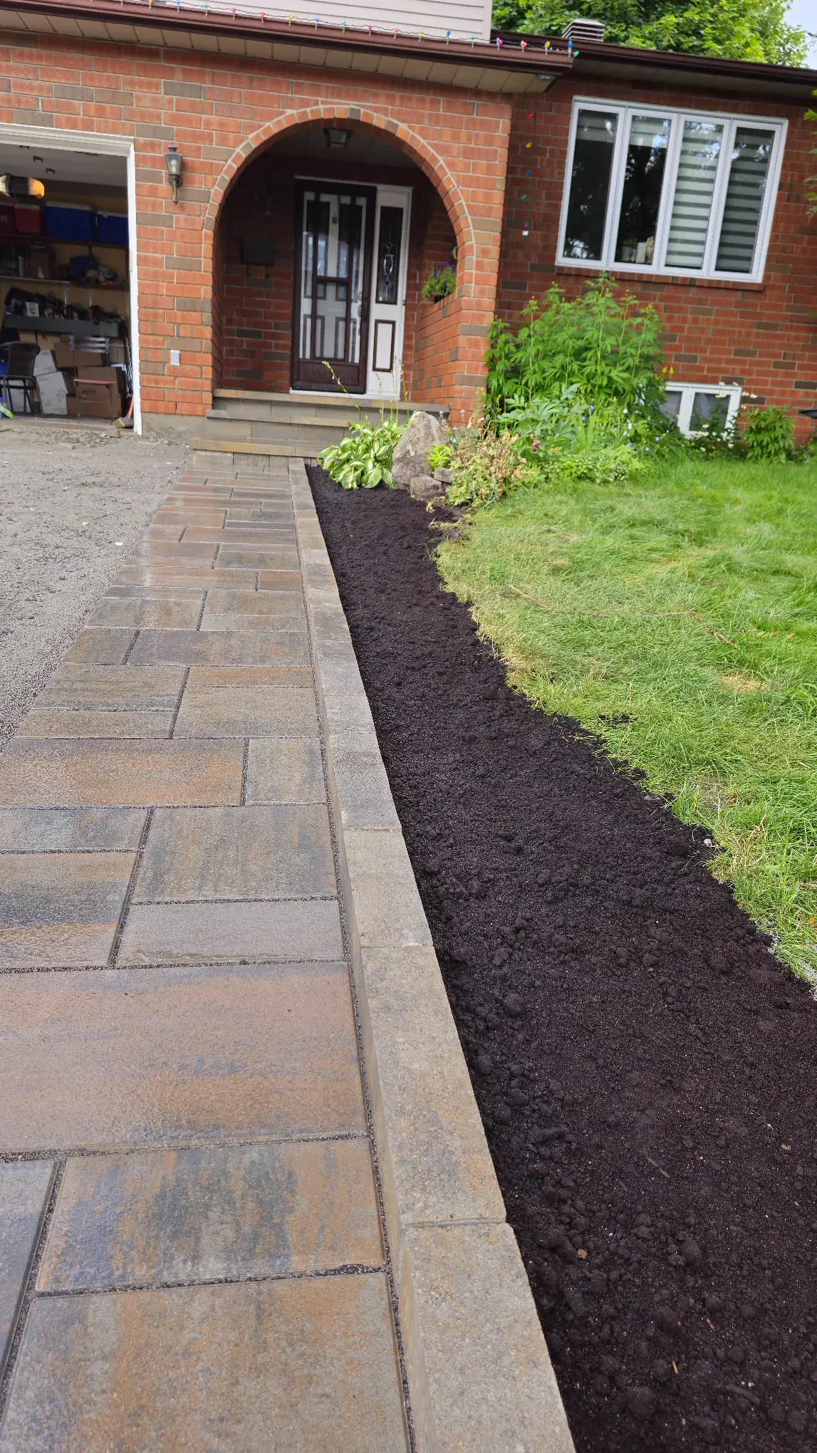Tan walkway and arched-brick porch transformation