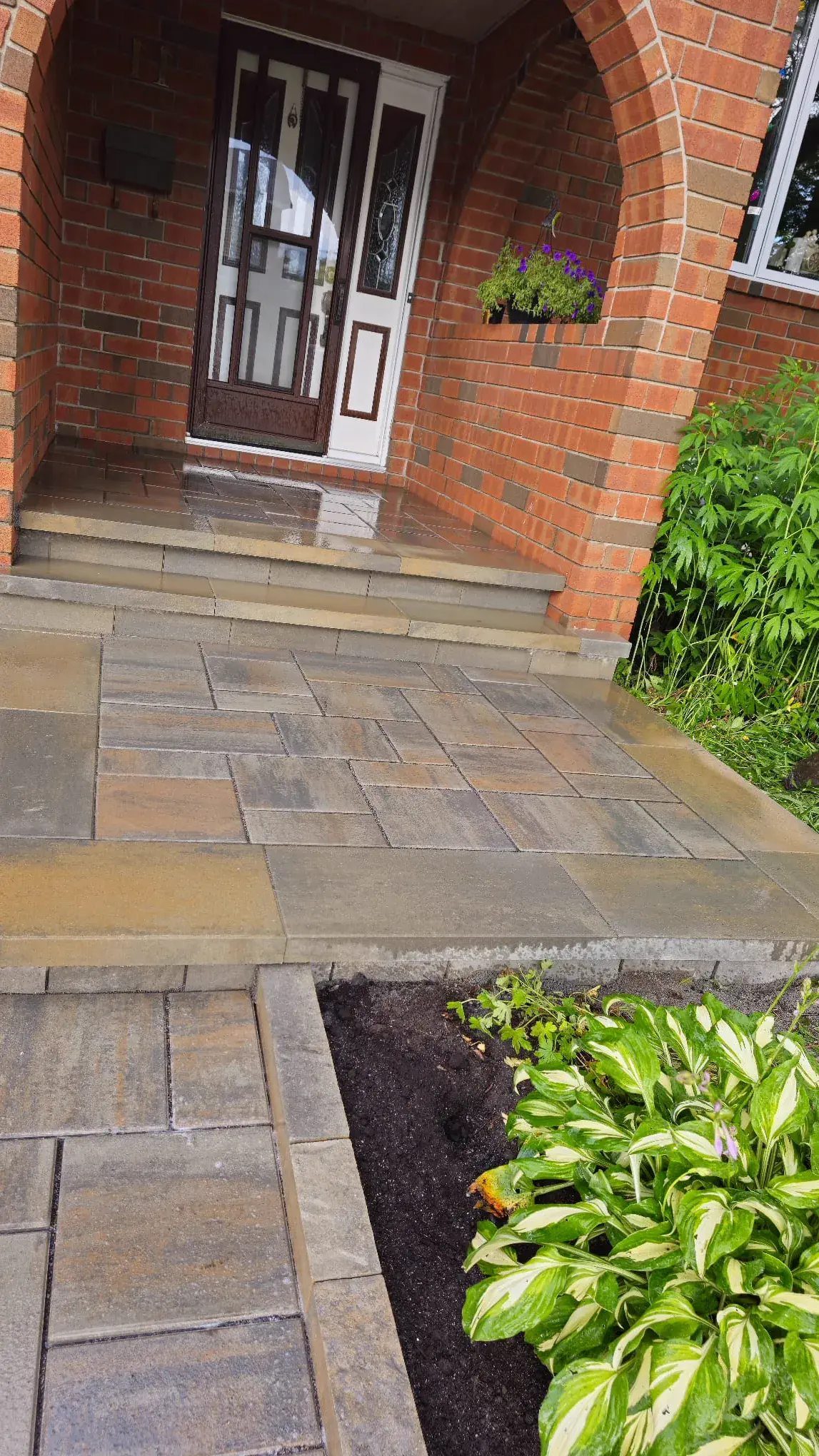 Tan walkway and arched-brick porch transformation